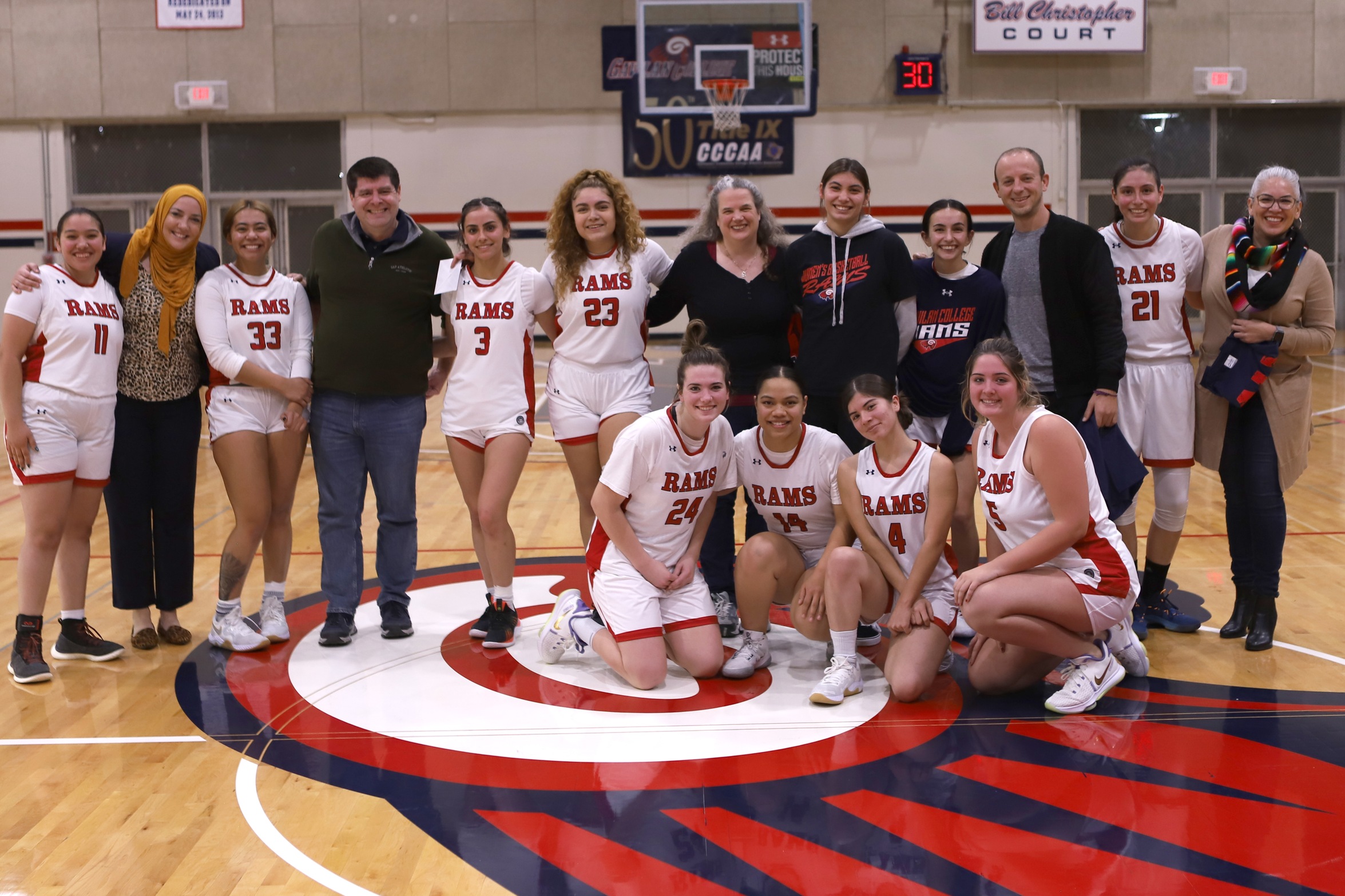 Women's basketball team with their favorite teachers